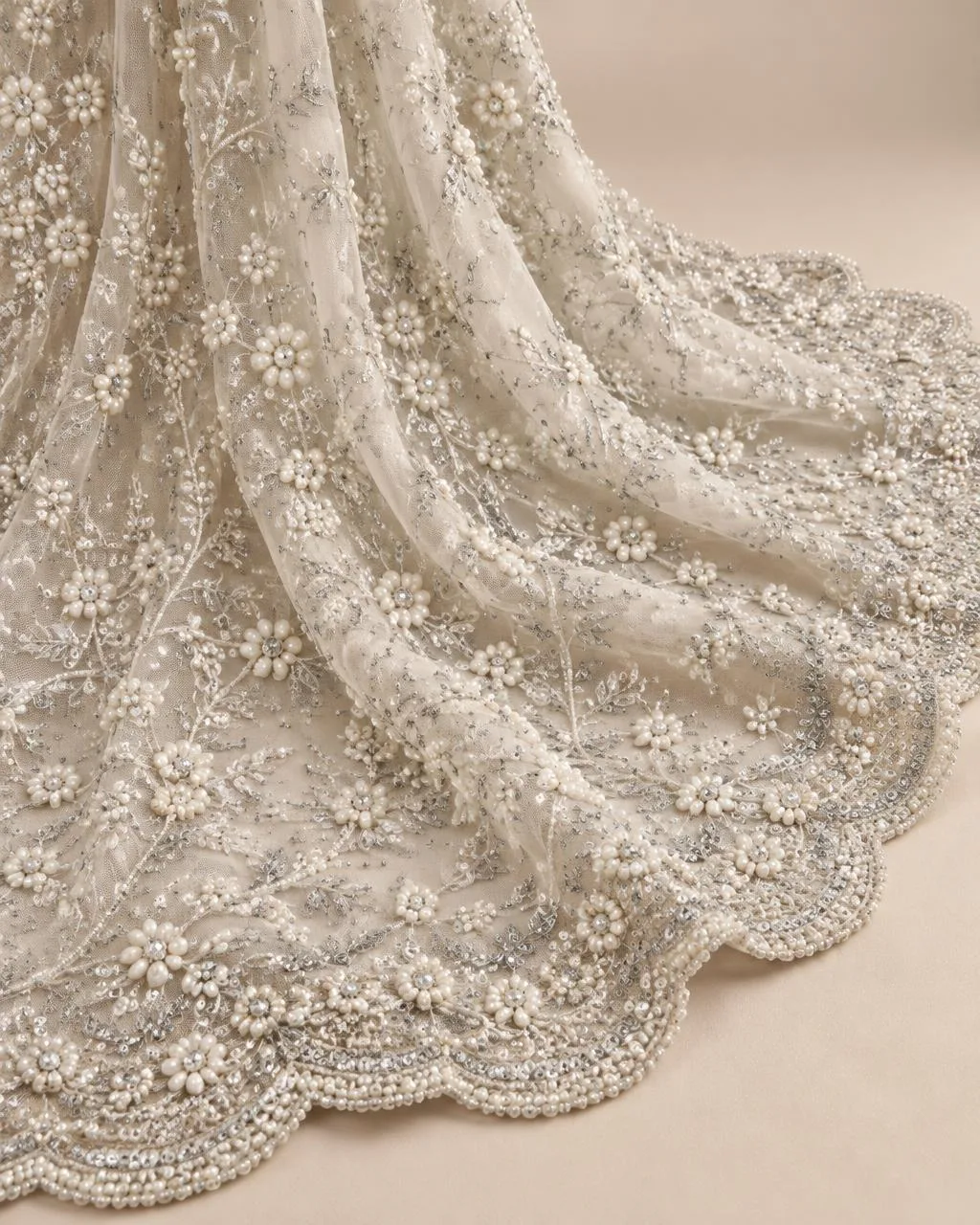 Ivory net with pearl and sequin floral jaal and scalloped border
