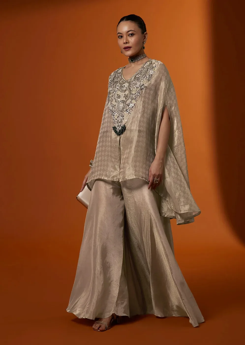 Model in a beige tissue kurta set with zardozi embroidery