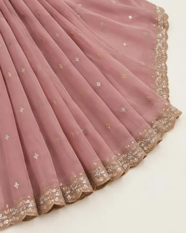 Dusty rose georgette saree fabric with sequin butis and scalloped zari border